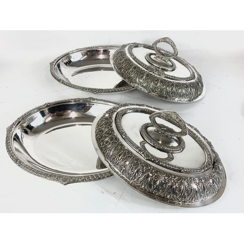 438 - A pair of good quality late 19th century ornate silver plated food servers. 31.5cm.