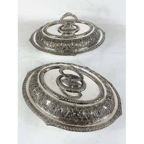 438 - A pair of good quality late 19th century ornate silver plated food servers. 31.5cm.