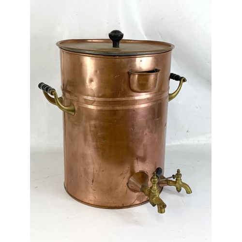 44 - A very large early 20th century copper dispenser with stoneware lining. Circa 1900. 50.5 x 53 x 56cm