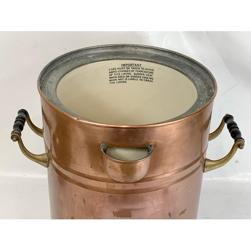 44 - A very large early 20th century copper dispenser with stoneware lining. Circa 1900. 50.5 x 53 x 56cm