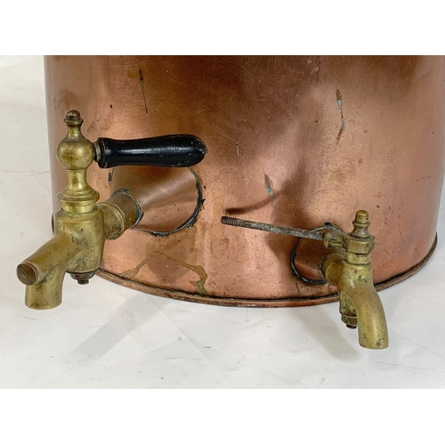 44 - A very large early 20th century copper dispenser with stoneware lining. Circa 1900. 50.5 x 53 x 56cm