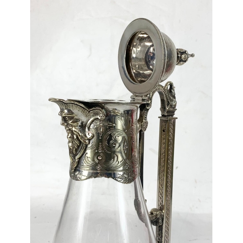 440 - A quality late 19th century ornate silver plated and crystal claret jug. 31.5cm