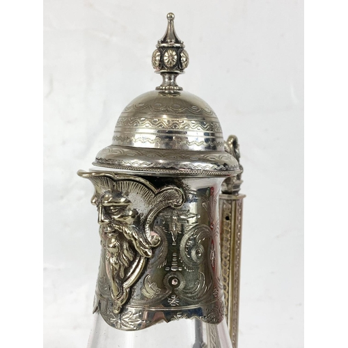 440 - A quality late 19th century ornate silver plated and crystal claret jug. 31.5cm