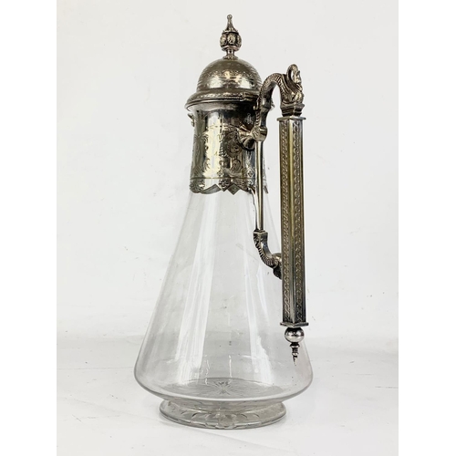 440 - A quality late 19th century ornate silver plated and crystal claret jug. 31.5cm