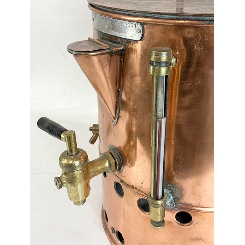 45 - A large vintage copper dispenser. 51 x 48 x 51cm.