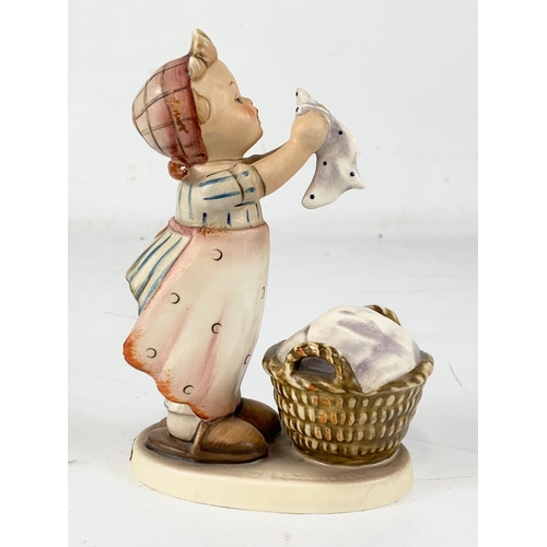 450 - A large M. J. Hummel Goebel pottery figure “Wash Day” West Germany. 1957. 15.5cm