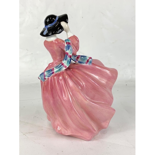 452 - A vintage Royal Doulton pink “Top O’ The Hill” pottery figurine. 19cm.