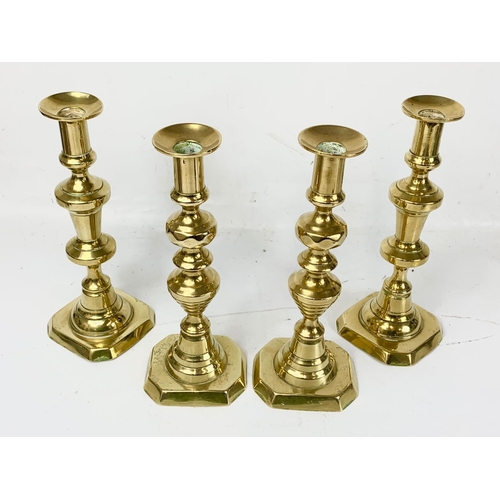 453 - 2 pairs of Victorian brass candlesticks. 25cm.