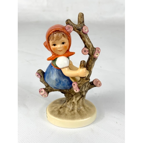 463 - An M. J. Hummel Goebel pottery figure in box “Apple Tree Girl” 143 3/0. Germany. Figure measures 11c... 