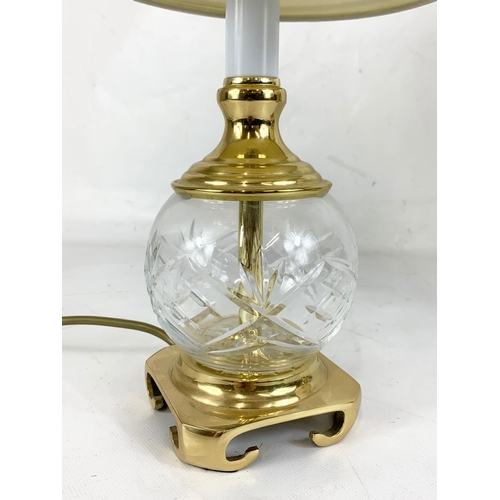 477 - A pair of crystal and brass table lamps. 39cm including shade.