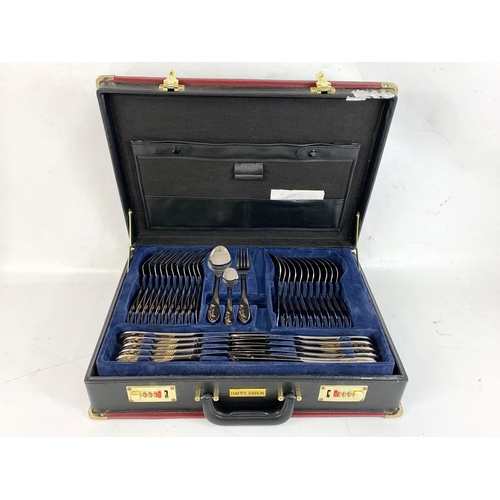 481 - A large Happy Baron canteen of cutlery in leather case. Case measures 46 x 33 x 11cm