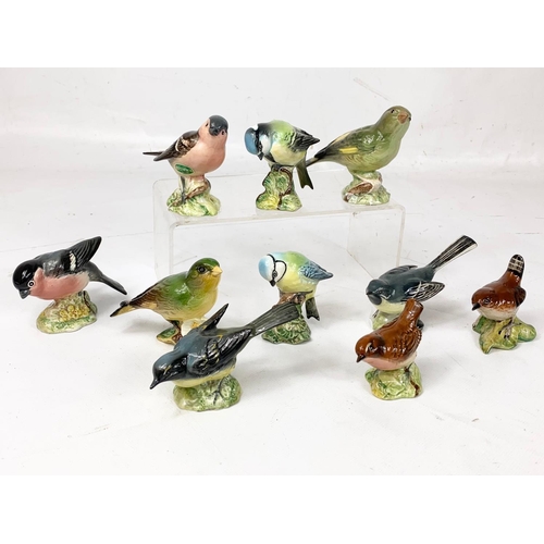 489 - A quantity of Beswick pottery birds. 10cm.