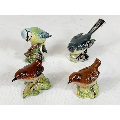 489 - A quantity of Beswick pottery birds. 10cm.