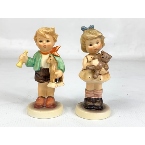 493 - 2 M. J. Hummel Goebel pottery figures “Cuddles & Boy With Horse” 9cm.