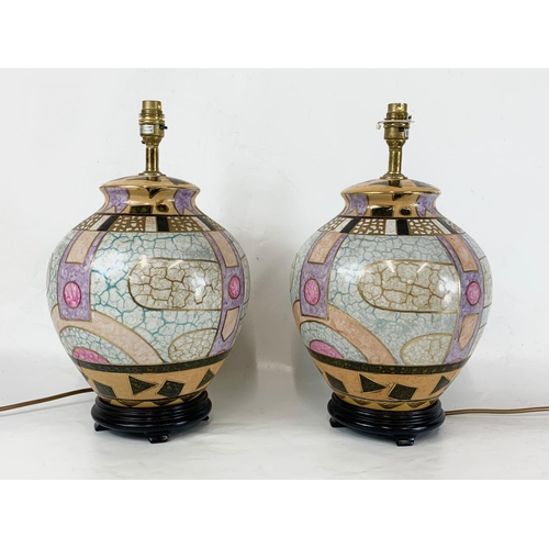 498 - A pair of large decorative ceramic table lamps. 28 x 43cm.