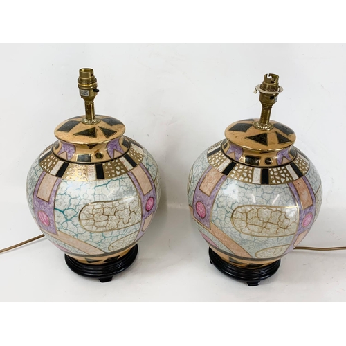 498 - A pair of large decorative ceramic table lamps. 28 x 43cm.