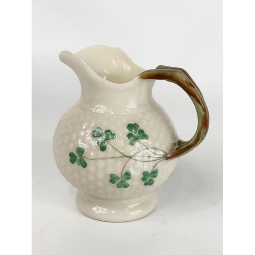 500 - A 2nd period Belleek pottery jug. 10 x 10cm.