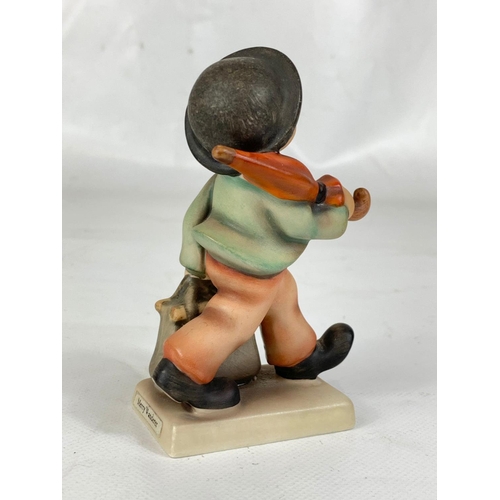 517 - An M. J. Hummel Goebel pottery figure “Merry Wanderer” 11 2/0. West Germany. 10.5cm.