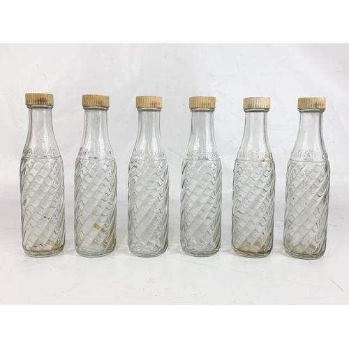 52 - A set of 6 vintage Soda Stream glass bottles with original lids. 21cm.