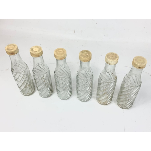 52 - A set of 6 vintage Soda Stream glass bottles with original lids. 21cm.