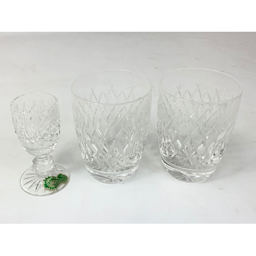 527 - A pair of Waterford crystal glasses and a Waterford crystal Sherry glass.