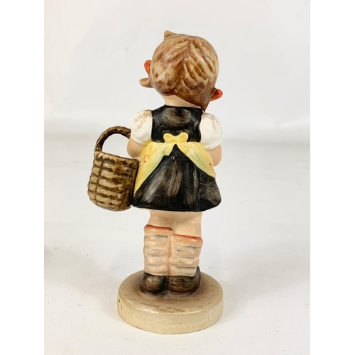 532 - An M. J. Hummel Goebel pottery figure “Sister” 98/2/0. West Germany. 12cm.