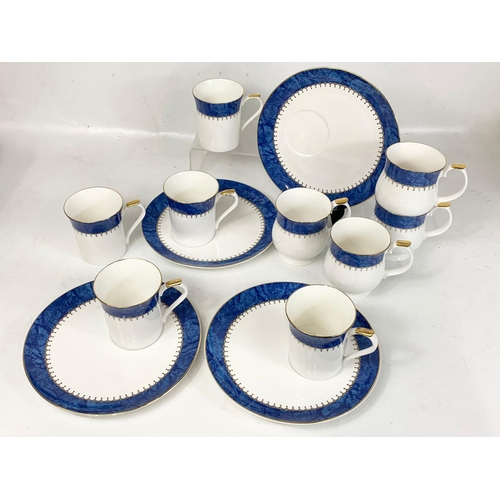 538 - A 13 piece Queen’s Fine Bone China “Symphony” tea and coffee set.