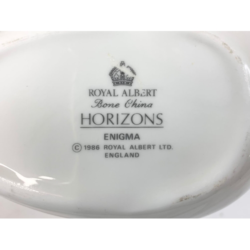 550 - A 14 piece Royal Albert Horizons Enigma dinner ware. 8 dinner plates, 4 bowls and a gravy boat.