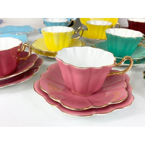 567 - 34 pieces of Royal Stuart Spencer Stevenson Art Deco style cups and saucers.