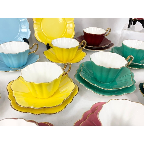 567 - 34 pieces of Royal Stuart Spencer Stevenson Art Deco style cups and saucers.