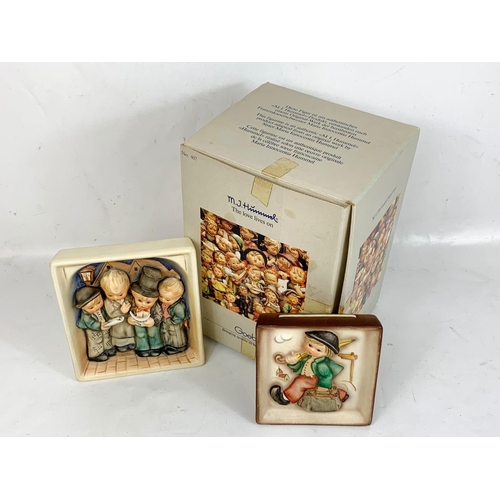 569 - M. J. Hummel Goebel pottery plaques with box. Largest plaque measures 14 x 16cm