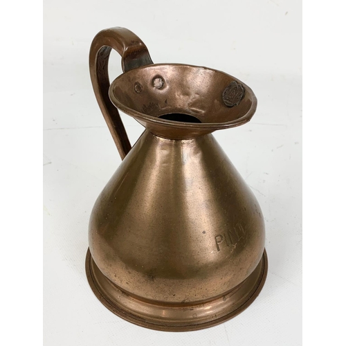 59 - A set of 4 early 20th century copper measuring jugs. Largest 18 x 16.5cm.