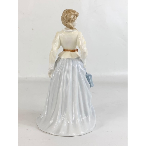 595 - A Royal Doulton “Fair Maid” pottery figurine. Countrymaid Collection. 21.5cm