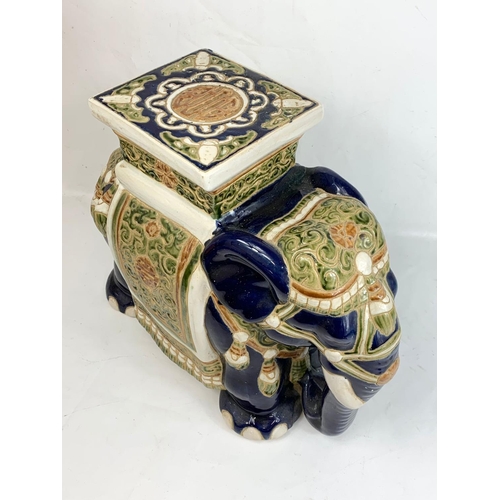 596 - A large vintage Majolica elephant garden seat or jardiniere stand 49 x 43cm.