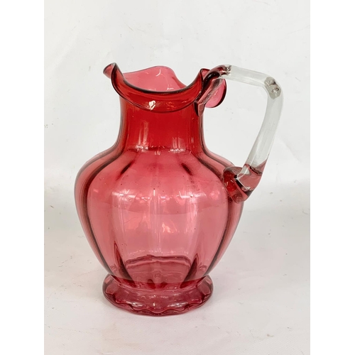 599 - A Victorian ruby glass jug. 17 x 19cm.