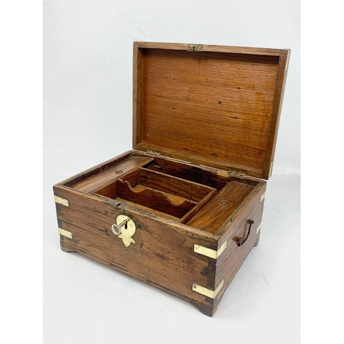 6 - A 19th century Anglo Indian brass bound and teak stationary box, circa 1860. 32.5cm x 26cm x 18cm