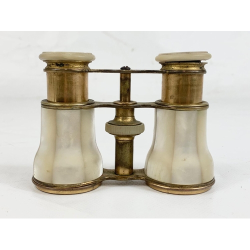 63 - A pair of vintage Mother of Pearl and brass opera glasses.