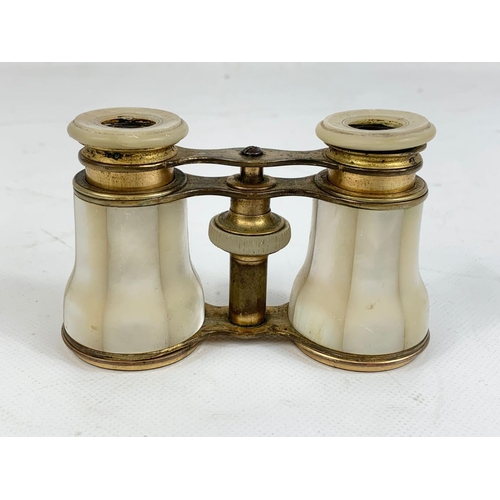 63 - A pair of vintage Mother of Pearl and brass opera glasses.