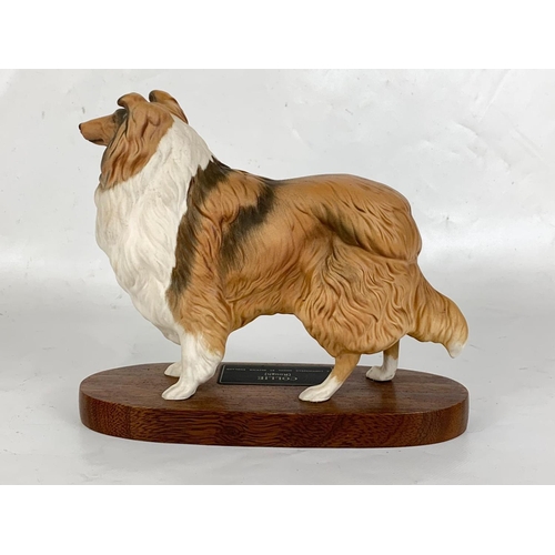 631 - A large Beswick pottery Collie dog on stand. 24 x 20.5cm