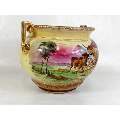 634 - A late Victorian pottery jardiniere. 31 x 23cm.