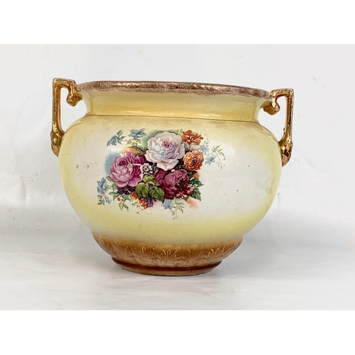 634 - A late Victorian pottery jardiniere. 31 x 23cm.