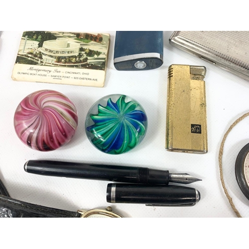 64 - A quantity of various collectibles. Including a Zippo Lighter, a Waterman fountain pen, an early 20t... 