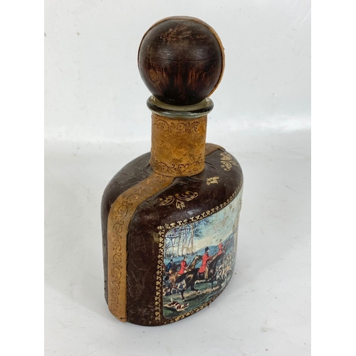 647 - A large vintage leather bound drinking flask. 16 x 26cm