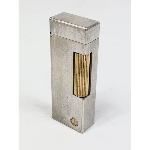 65 - A vintage silver plated Dunhill lighter. Reg number 24163. 6.5cm.