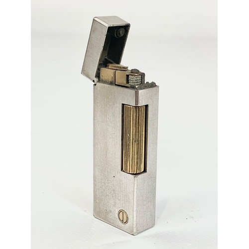 65 - A vintage silver plated Dunhill lighter. Reg number 24163. 6.5cm.