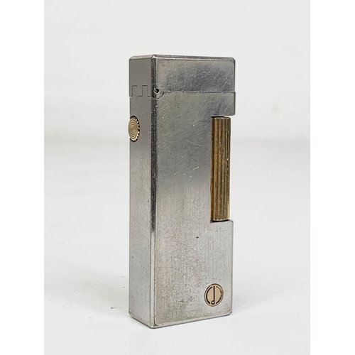 65 - A vintage silver plated Dunhill lighter. Reg number 24163. 6.5cm.