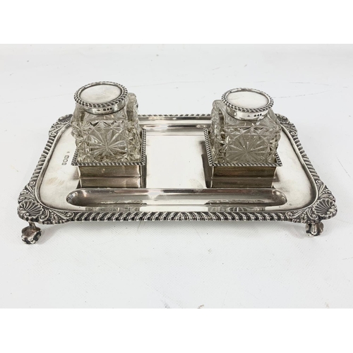 653 - An early 20th century silver pen and ink stand.  London 1919, 552gms.  Not including bottles and lid... 