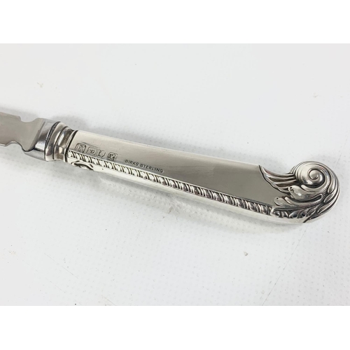 654 - A silver handled letter opener.