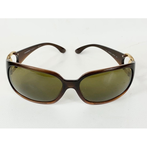 667 - A pair of ladies Chanel sunglasses in case.