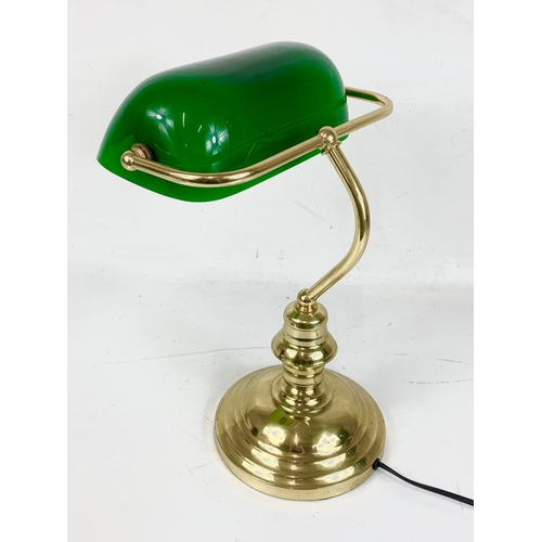 67 - A brass desk lamp with glass shade. 38cm